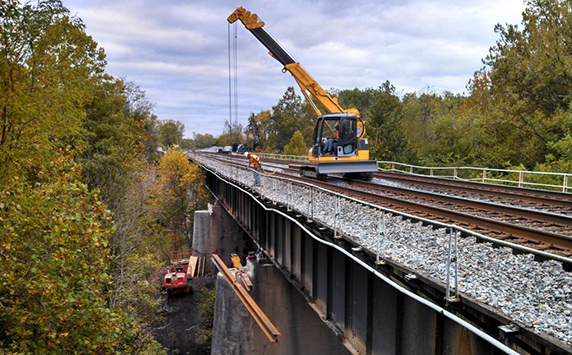 MAEDA Crawler Crane lifting on rail road side for construction